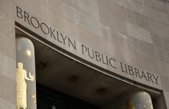 Facade of the Brooklyn Public Library, featuring its name prominently displayed.