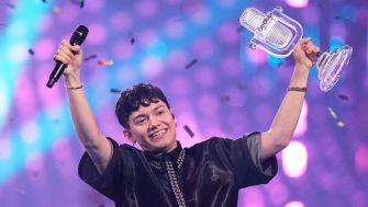 JJ from Austria, holds up the trophy onstage after winning the 69th Eurovision Song Contest in Basel, Switzerland.