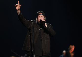 Jelly Roll performing at Saratoga Performing Arts Center, addressing rumors about his recent divorce from Bunnie Xo.