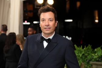 Jimmy Fallon in a formal outfit at an event.