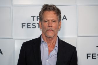 Kevin Bacon at the Tribeca Festival, discussing his film project "Family Movie" alongside his family.