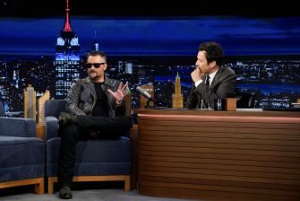 Eric Church being interviewed by Jimmy Fallon on The Tonight Show, discussing his early career and memories with Taylor Swift.