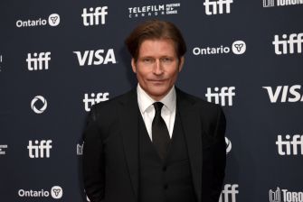 Actor Crispin Glover poses on the red carpet at a film festival event.