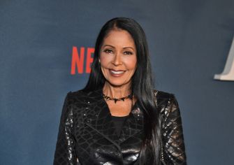 Actress and singer Patty Kotero, known as Apollonia, smiling at an event.