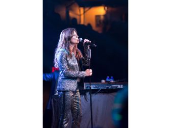 Martina McBride performing on stage at an event.