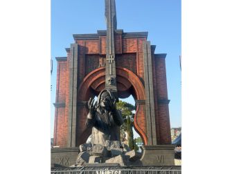 A nearly 20-foot statue of Ozzy Osbourne unveiled at Hellfest, featuring the phrase "Let the Madness Begin" at its base.
