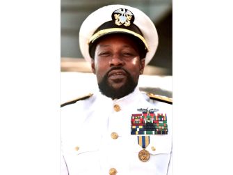 Victor Willis in a naval-inspired uniform, showcasing his iconic persona as the lead vocalist of the Village People.