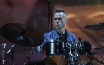 Matt Cameron performing on stage as the drummer for Pearl Jam.