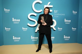 Jim Carrey holding his Honorary César Award at the ceremony in Paris.