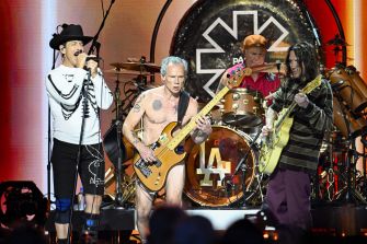 Red Hot Chili Peppers performing on stage.