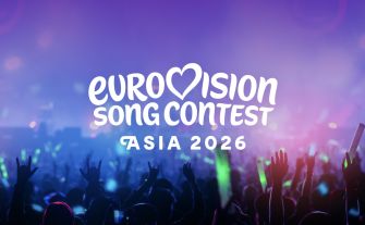 Logo of the Eurovision Song Contest Asia 2026 with a vibrant crowd and colorful lighting in the background.