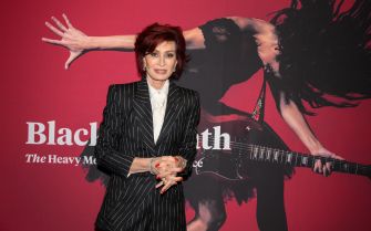 Sharon Osbourne posing at an event related to heavy metal music.