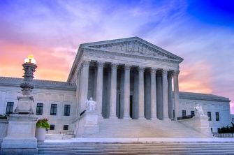The U.S. Supreme Court building at sunset.