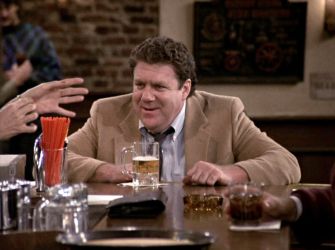George Wendt as Norm at Cheers bar.
