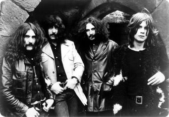 Black Sabbath members posing together in a historic black-and-white photo from the late 1960s.