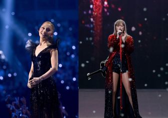 Image featuring two female pop artists performing on stage at a concert. One is dressed in a black, sparkly gown, and the other is in red sequins with a guitar.