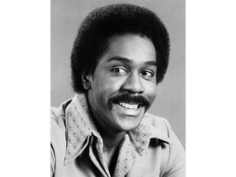 Demond Wilson, actor known for his role in "Sanford and Son," smiling in a vintage portrait.