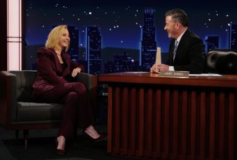 Lisa Kudrow laughing and speaking with Jimmy Kimmel during an interview on 'Jimmy Kimmel Live!'
