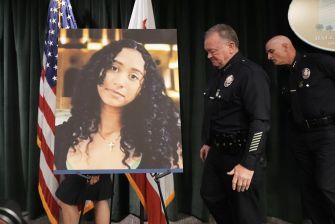 Family members stand beside a portrait of 14-year-old Celeste Rivas Hernandez during a press conference addressing the murder charge against singer D4vd.