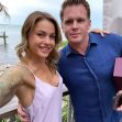 Christmas Abbott and Memphis Garrett posing for a selfie by the water, with palm trees and a pier in the background. Christmas Abbott and Memphis Garrett posing for a selfie by the water, with palm trees and a pier in the background.