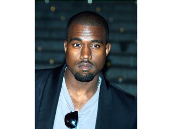 Kanye West at a public event, facing legal proceedings over copyright disputes related to his music.